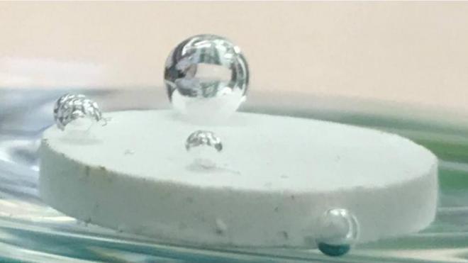 A drop of water on a pellet made of salt from the Dead Sea with low percent of a hydrophobic material